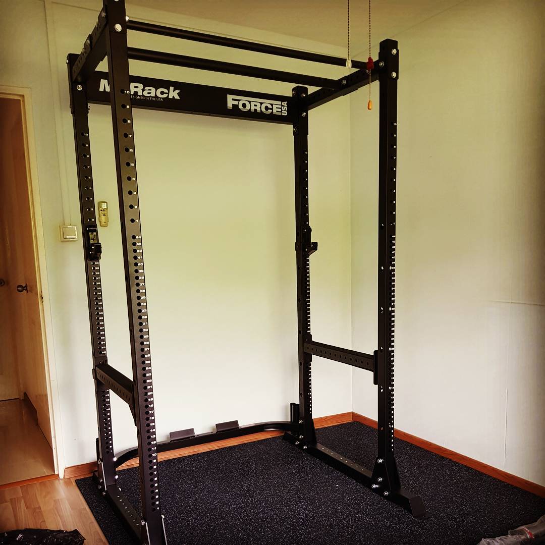 Force USA power rack. Comes default with normal and fat grip chin up bars. More than 50 adjustment holes available for different height fir bar racking.