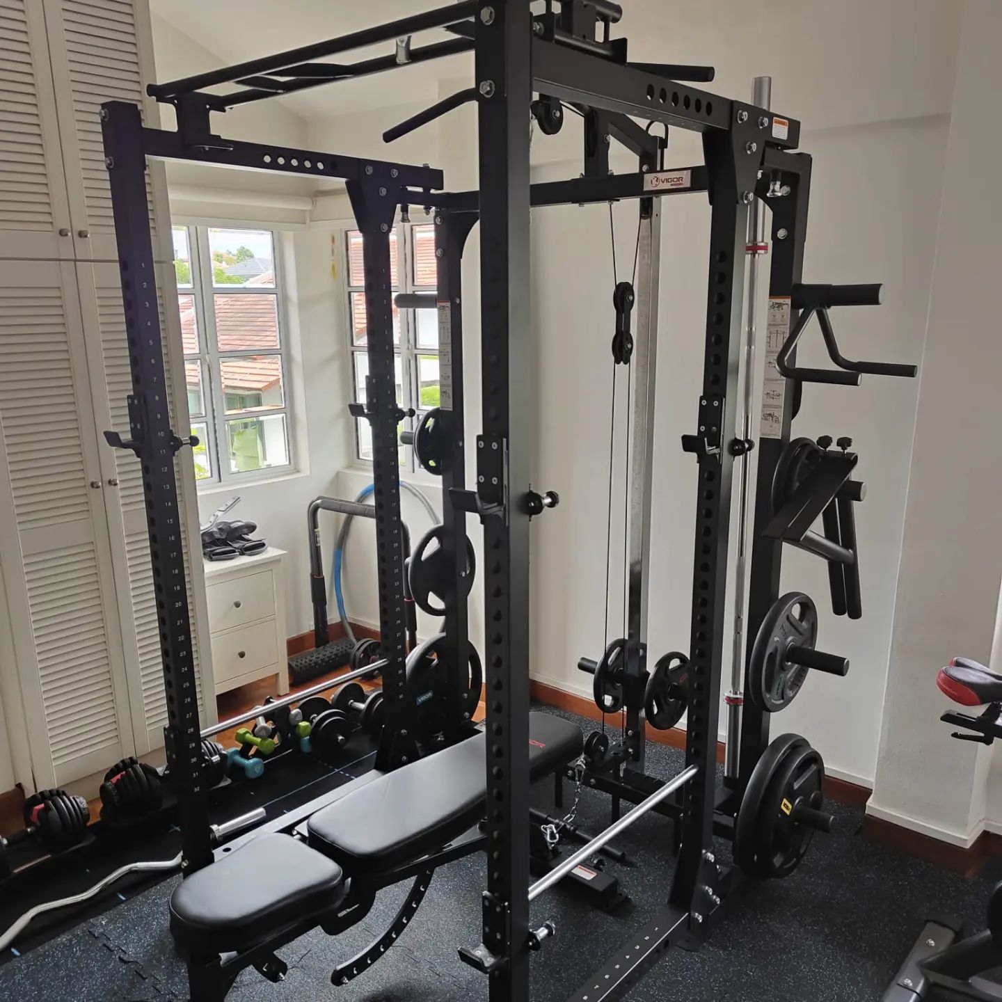 If you want to maximize your space, the folding power rack is a good option, which allows normal barbell exercises, cable exercises and comes with many other accessories to supplement every workout. Plus it has storage for weights, barbells and accessories!  #homegymsg #sgfitness #sgfitfam #homegym #gymequipment #homegymsetup