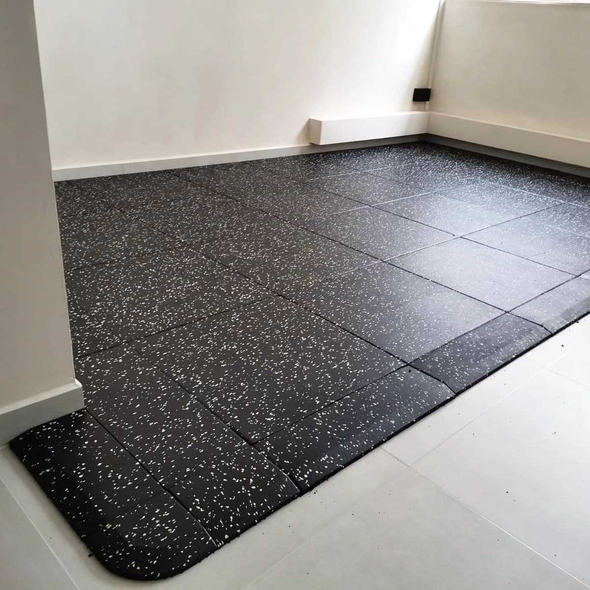 2cm thick gym tile installation with nice slope finish.