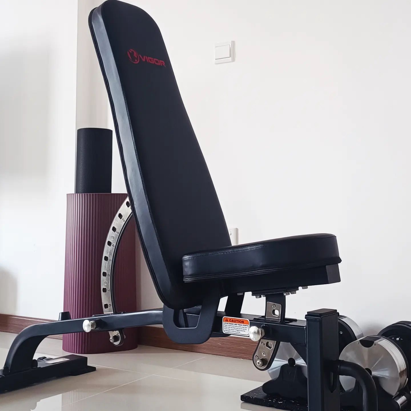 A home gym setup can be as simple as an adjustable bench, dumbbells and mats.