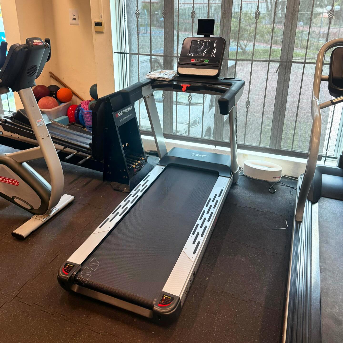 Reebok SL8 AC light commercial treadmill setup in a school