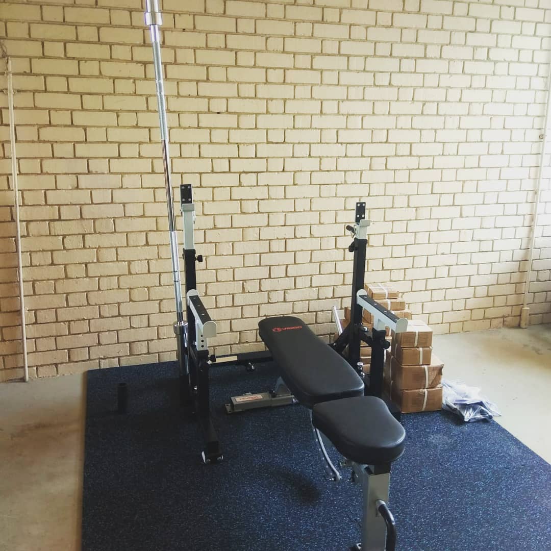 Squat stand with storage for bar and weights. One of the most compact in Singapore.